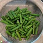 drained green beans in a colander