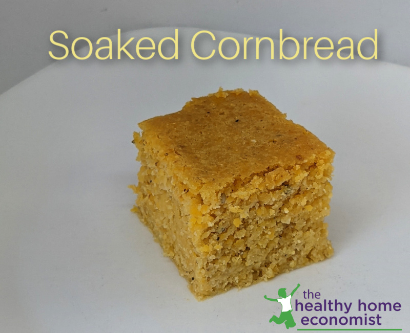 square of soaked cornbread on a white plate