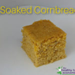 piece of soaked cornbread on a white plate