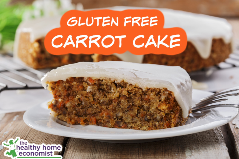 slice of healthy gluten-free carrot cake with icing on a white plate