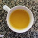 turmeric latte in a white mug on granite counter