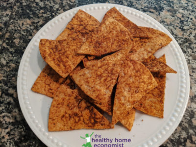 dorito-style chips on a plate on granite countertop