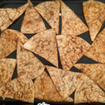 homemade taco doritos on a baking sheet