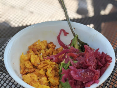 turmeric scrambled eggs with avocado in a bowl