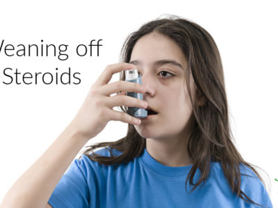 young girl using a steroid inhaler