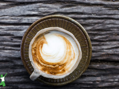 healthy pumpkin spice latte in a mug wooden background