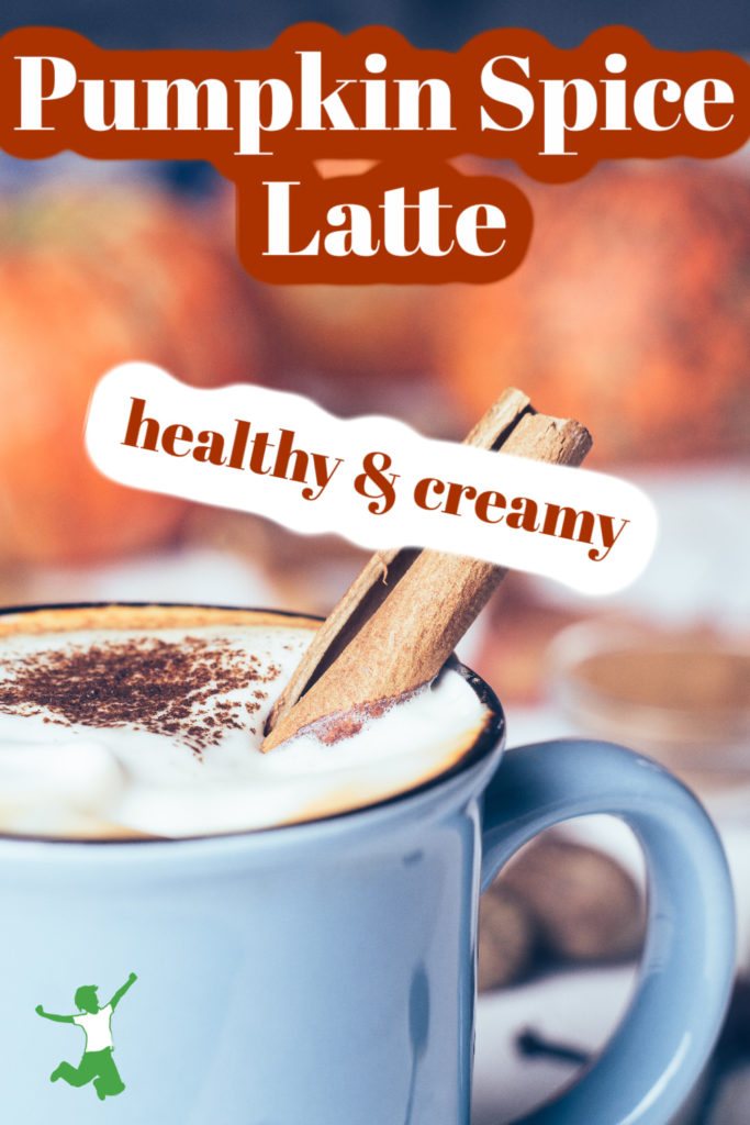 foamy and creamy pumpkin spice latte with cinnamon stick in a blue mug