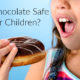 little girl eating chocolate donut