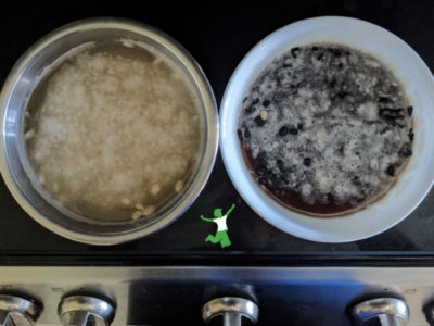 sprouted black beans soaking in a white bowl