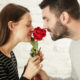 man and woman smelling a rose after covid recovery