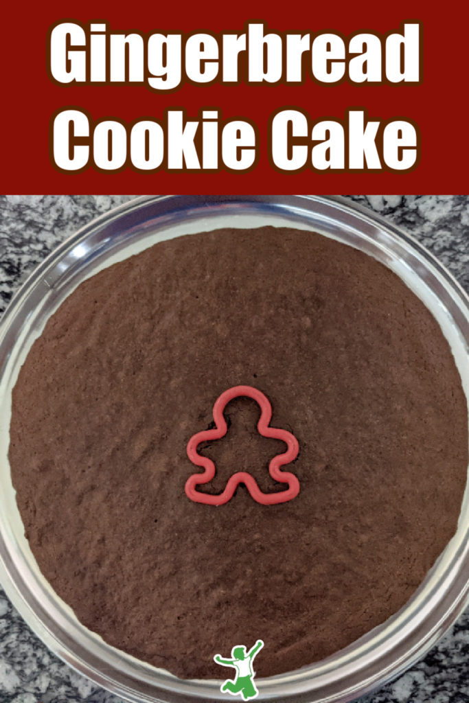 molasses gingerbread cake with gingerbread boy cutout in center of baking pan