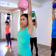 class of women doing a kettlebell workout