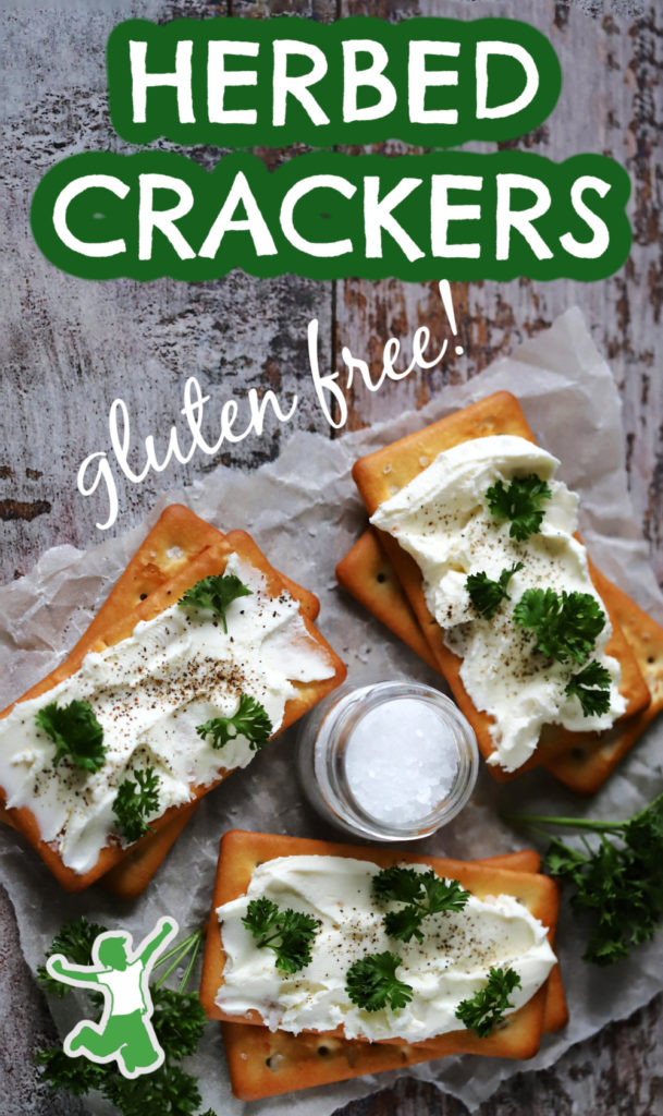 sprouted gluten free crackers with herbed cream cheese dip on wooden background