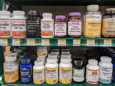 bottles of quercetin supplement at health food store