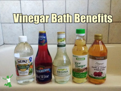 bottles of vinegar for bathing on edge of tub