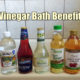bottles of vinegar for bathing on edge of tub