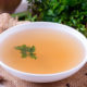 remouillage broth in a white bowl