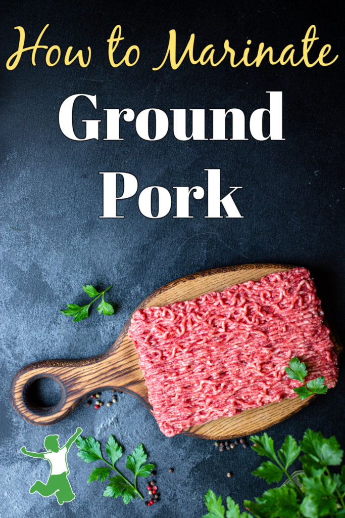 marinating ground pork on a cutting board with parsley