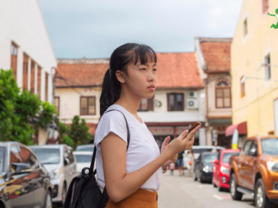 young woman holding 5G phone alternative