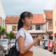 young woman holding 5G phone alternative