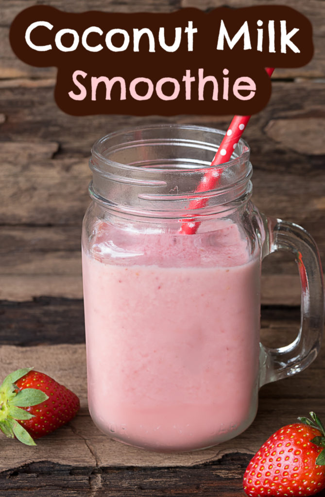 coconut milk smoothie in a mason jar with strawberries