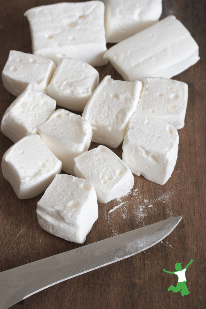 homemade marshmallow cut into squares on a wooden background