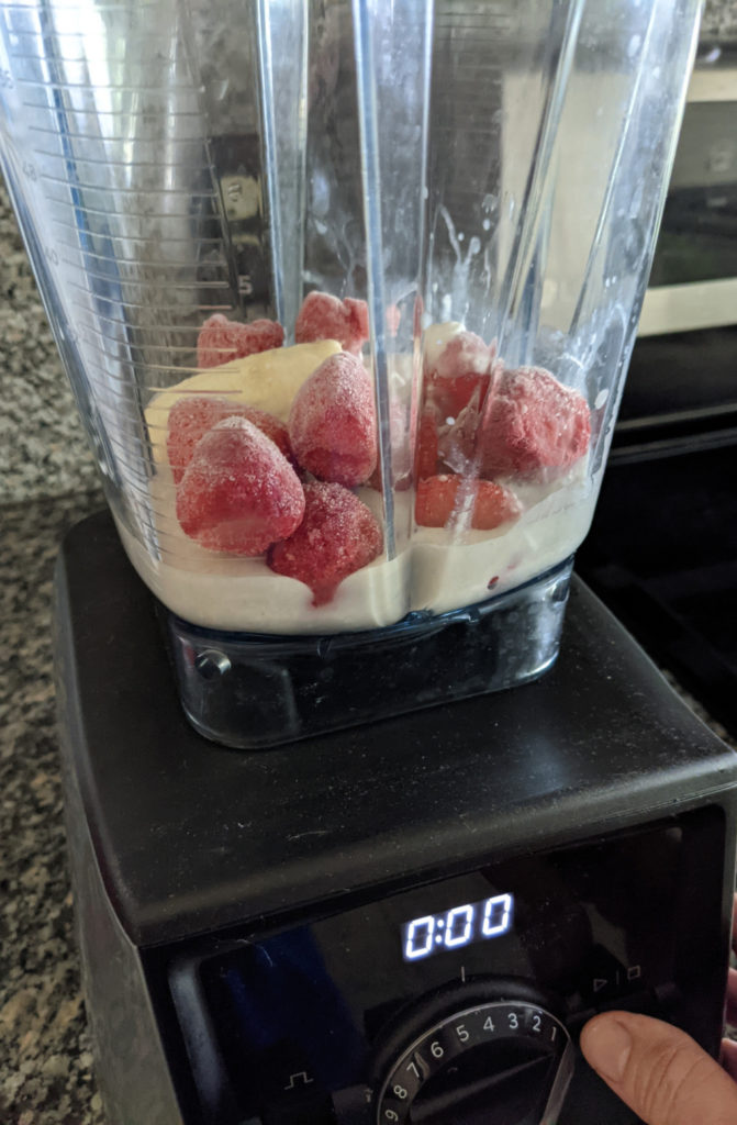 ingredients for coconut milk fruit smoothie in a Vitamix