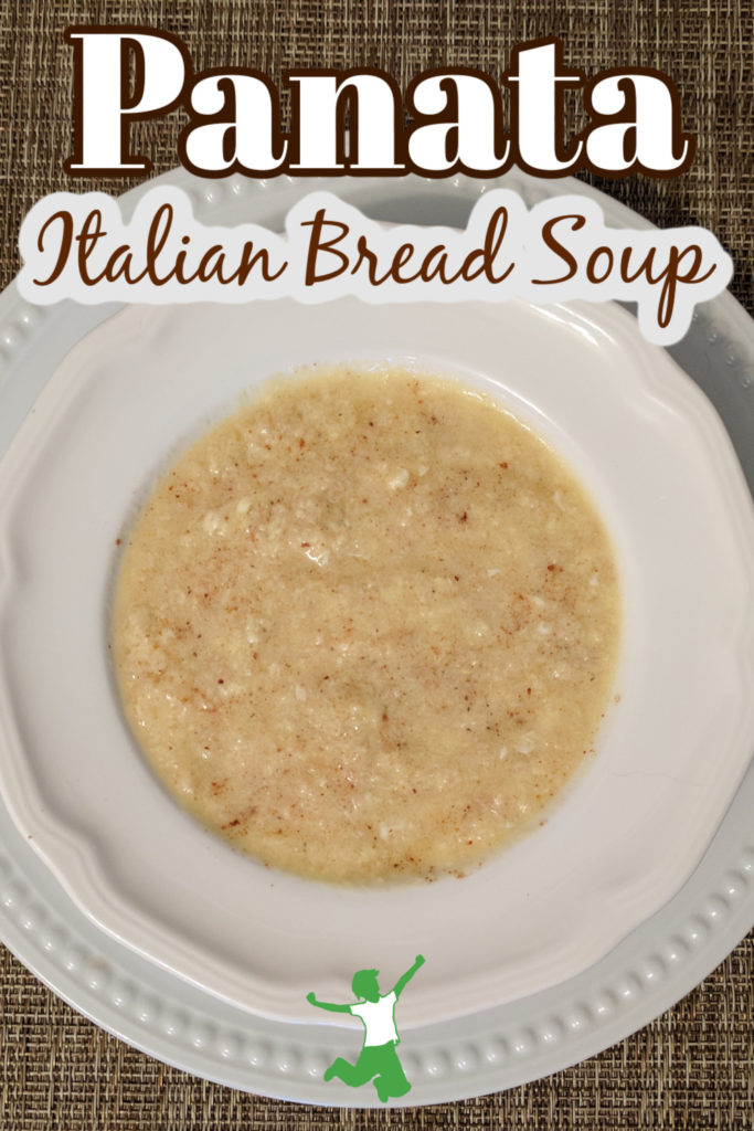 bowl of Italian panata bread soup in a white bowl on brown background