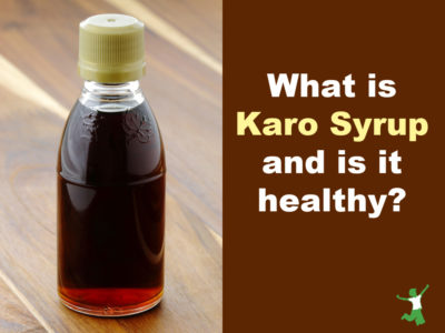 bottle of dark karo syrup wooden background