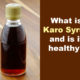 bottle of dark karo syrup wooden background