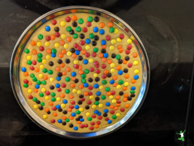 healthy m&m cookie on stainless steel pan