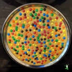 m&m cookie cake on a pan