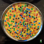 m&m cookie cake on a pan