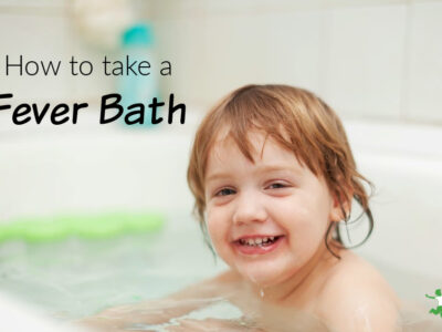 smiling child taking a fever bath for faster healing