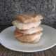 bread crusts stacked on a white plate