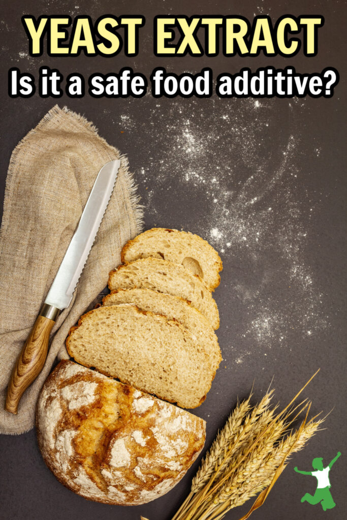 bread with yeast extract on a cutting board with knife