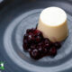 classic panna cotta with blueberries on a plate