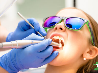 woman getting a six month cleaning at the dentist