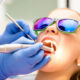 woman getting a six month cleaning at the dentist