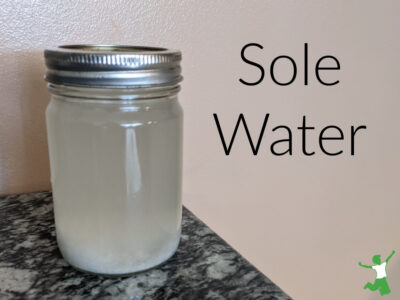 sole water in a small mason jar on granite table