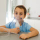 young girl using a nebulizer with hydrogen peroxide