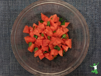 fermented watermelon and mint salad in glass serving bowl