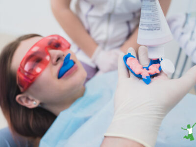 child getting fluoride treatment at the dentist