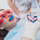 child getting fluoride treatment at the dentist