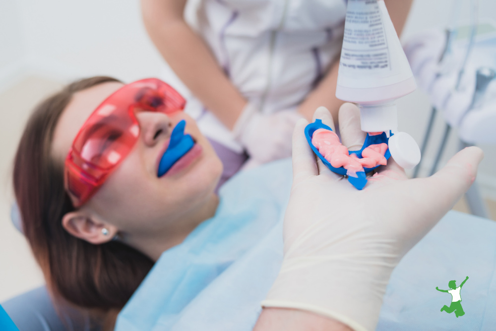 young girl getting fluoride treatment at the dentist