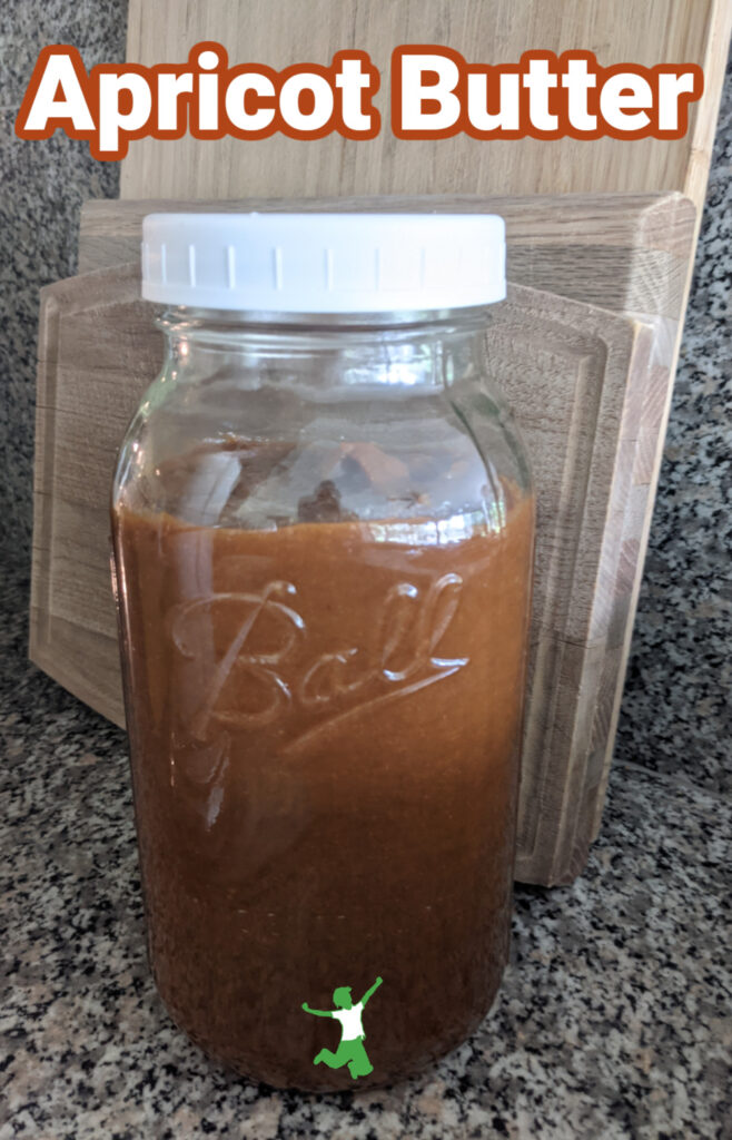 homemade apricot butter in mason jar on granite counter