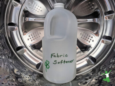 jug of DIY fabric softener inside washing machine