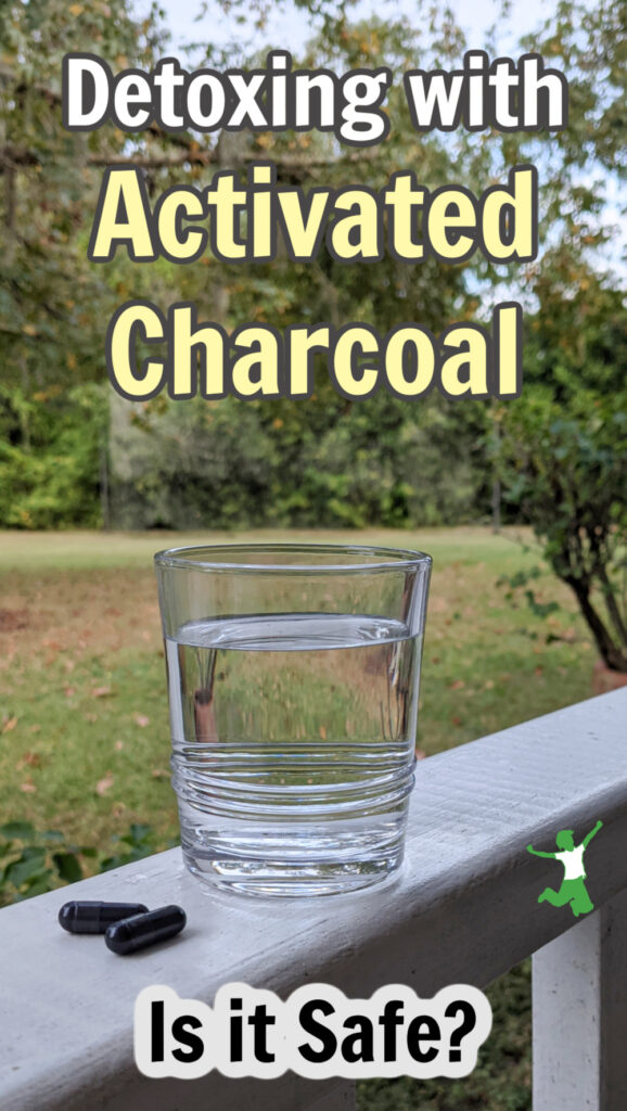 activated charcoal capsules with glass of water on porch railing