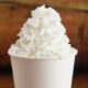 illegal adulterated heavy whipping cream in a white cup