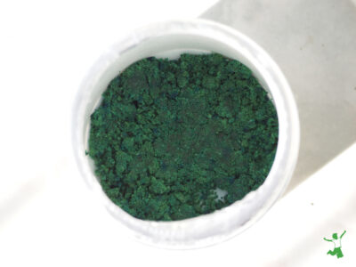 low oxalate powdered greens in a white cup